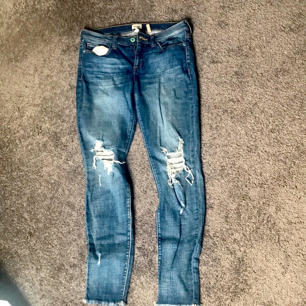 Distressed blue jeans